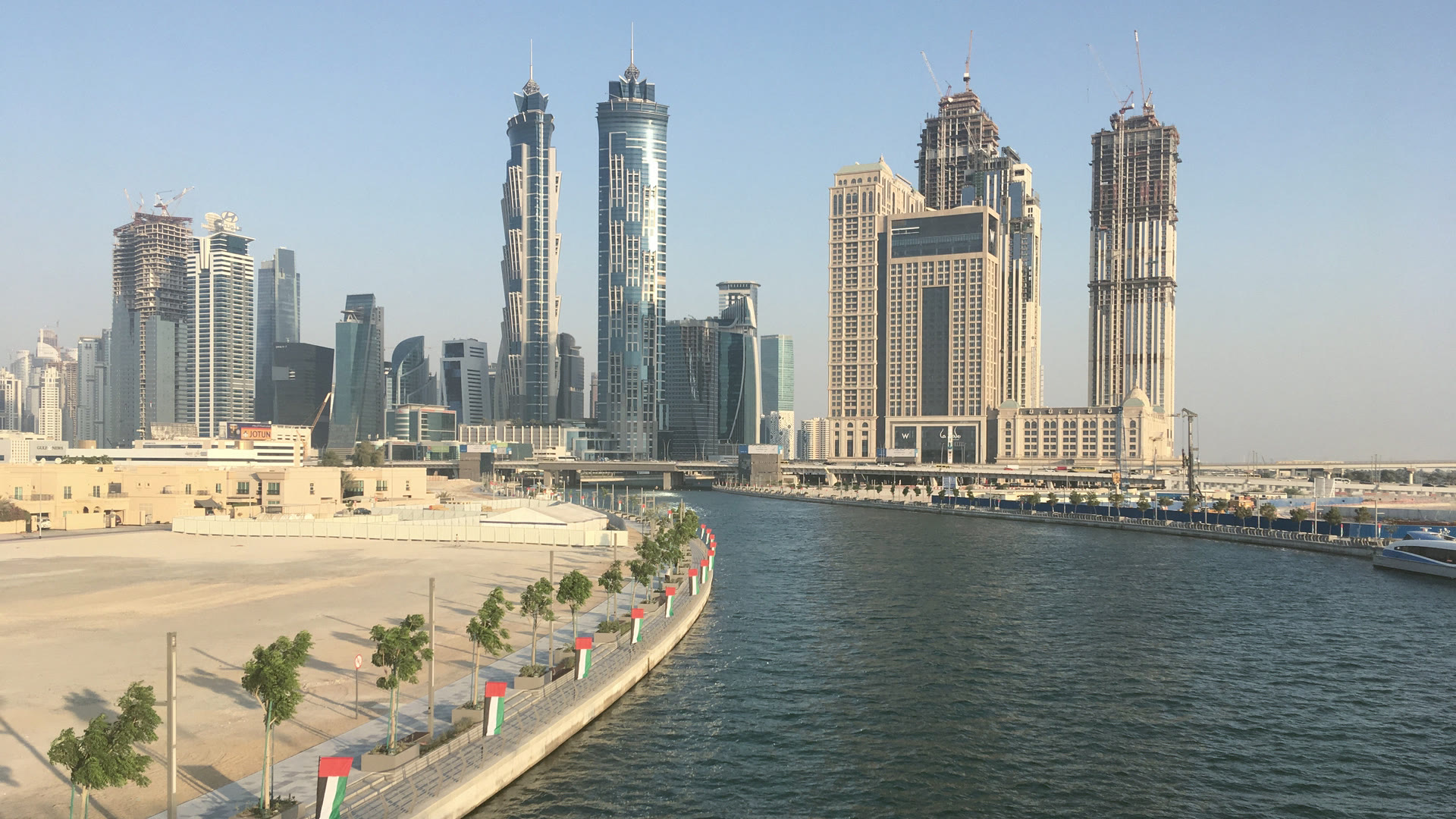 The Dubai Water Canal at Business Bay, with the towers along its bank in afternoon light